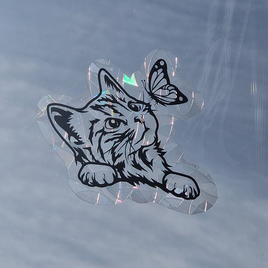 Rainbow window decoration with a cat motif
