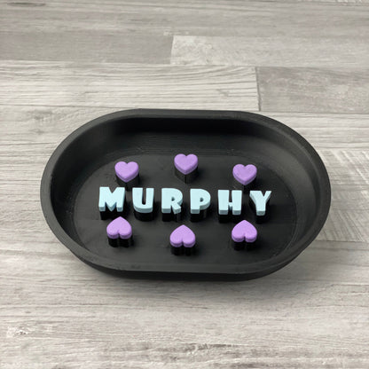 Black personalised slow feeder with the name MURPHY in light blue and purple hearts